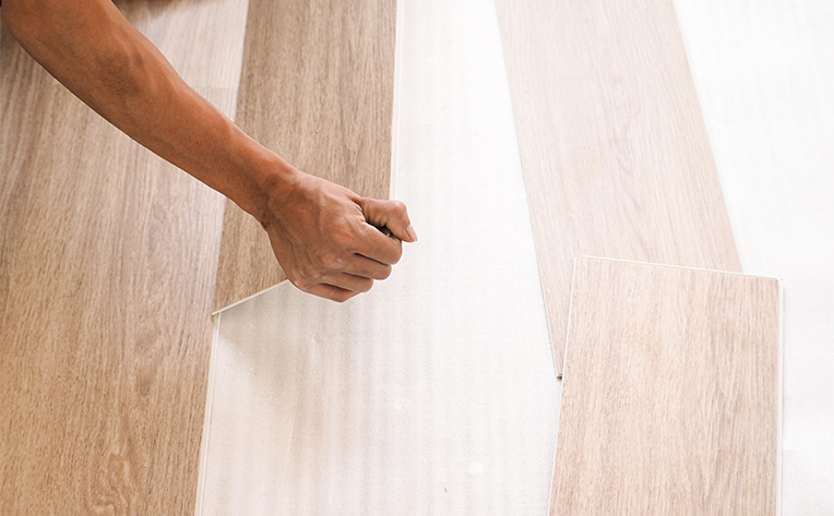 stock image wood flooring being installed using click-lock method